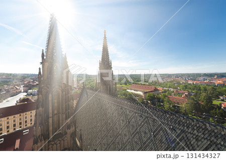 Sun shining on the roof of st. Vitus cathedral and offering a panoramic view of Prague 131434327