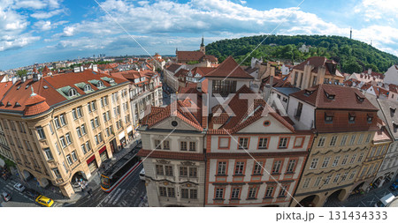 Fisheye lens capturing the charm of Prague's Old Town with its traditional red roofs and lush green hills Fisheye lens capturing the charm of Prague's Old Town with its traditional red roofs and lush green hills 131434333