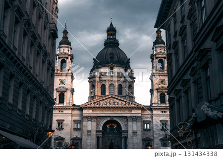 St. Stephen's basilica standing tall between buildings in Budapest, Hungary St. Stephen's basilica standing tall between buildings in Budapest, Hungary 131434338