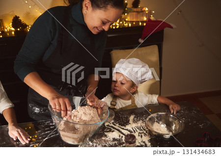 Joyful Family Baking Gingerbread Together: Mom And Child Cooking Christmas Treats At Home 131434683