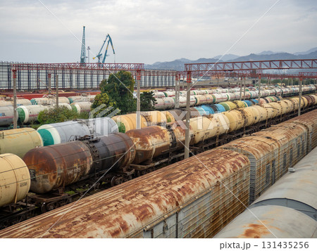 Parking for many trains. Freight trains. Railway station. Industrial zone in the city. View from above. Concept of cargo delivery by train Parking for many trains. Freight trains. Railway station. Industrial zone in the city. View from above. Concept of cargo delivery by train 131435256