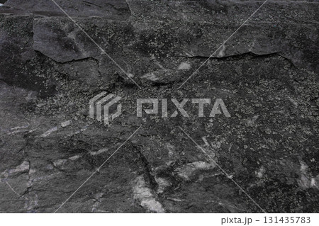 Dark stone texture with natural rough surface and layered structure. Dark stone texture with natural rough surface and layered structure. 131435783