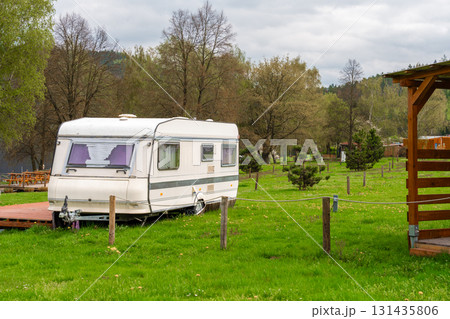 Vintage travel trailer in green campsite near Slapy lake in Nove Zivohost, Czech Republic 131435806