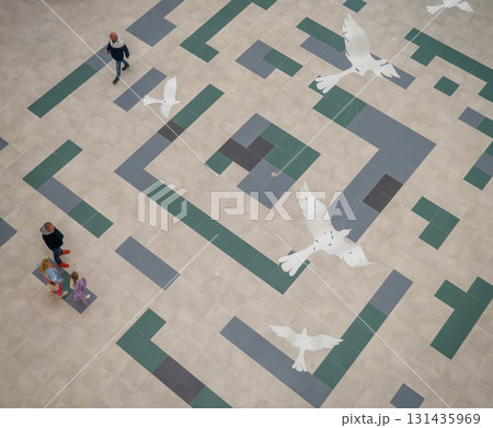 lobby of a new shopping center. Light walls of a shopping center. New Batumi Mall. A place to shop. Modern interior. Part of the interior. View from above lobby of a new shopping center. Light walls of a shopping center. New Batumi Mall. A place to shop. Modern interior. Part of the interior. View from above 131435969