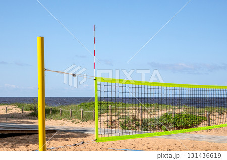 Empty Beach Volleyball Court on Sandy Shore by the Sea in Summer 131436619
