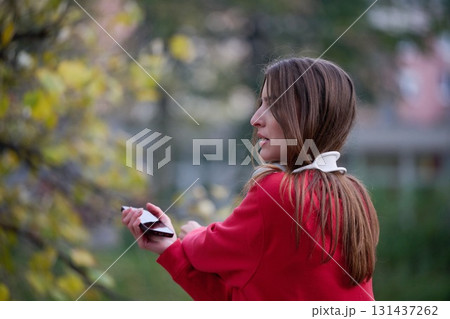 Athletic young woman taking a breath and relaxing after jogging and stretching. Woman Training and Workout Exercises On Street. 131437262