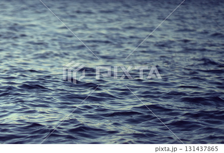 A water surface with small waves, a beautiful ocean closeup. A water surface with small waves, a beautiful ocean closeup. 131437865