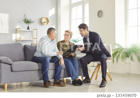 Senior Couple Meeting With Consultant At Home 131439070