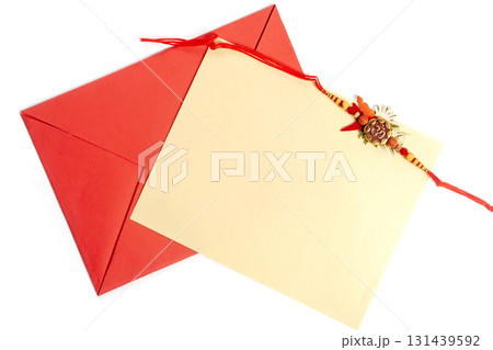 Raksha Bandhan greeting card with decorative rakhi and red envelope Raksha Bandhan greeting card with decorative rakhi and red envelope 131439592