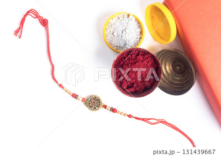 Rakhi bangle with colored powders for the celebration of the Indian festival of Raksha Bandhan. Rakhi bangle with colored powders for the celebration of the Indian festival of Raksha Bandhan. 131439667