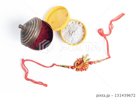 Rakhi bangle with colorful beads and powder containers for festive celebration 131439672