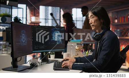 CTO manager in AI focused startup designing, coding and debugging applications in different software languages. Chief technician officer doing code testing and quality assurance, camera A 131439883