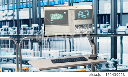 Monitor displaying industrial analytics dashboard for Industry 4.0 photovoltaics plant equipment. Solar panels smart factory display visualizing robotic arms performance and metrics from sensor data 131439928