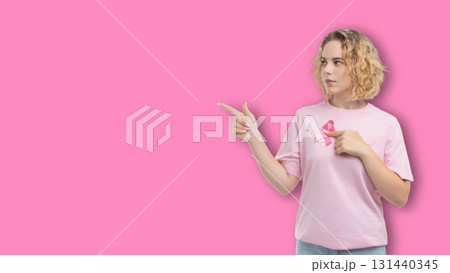 Woman in pink shirt promotes cancer awareness Woman in pink shirt promotes cancer awareness 131440345