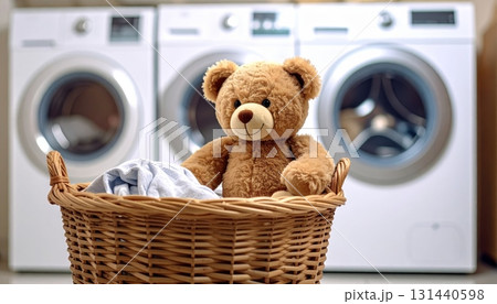 Teddy Bear in Laundry Basket in Laundry Room Teddy Bear in Laundry Basket in Laundry Room 131440598
