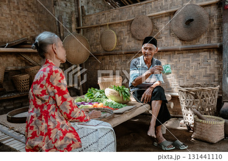 Cultural Exchange Taking Place in a Traditional Market Focused on Fresh Produce 131441110