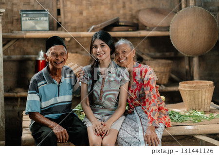 Joyful Family Gathering in a Traditional Village, Filled with Warmth and Happiness Joyful Family Gathering in a Traditional Village, Filled with Warmth and Happiness 131441126