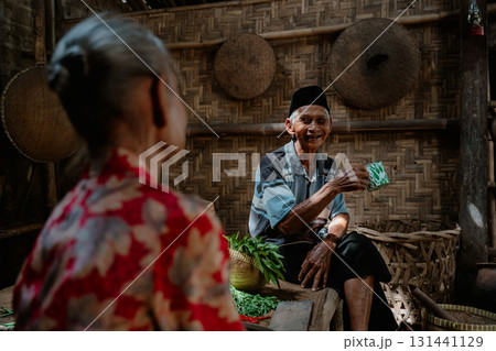 A Warm Interaction Between Elders in a Charming Rustic Setting Full of Warmth and Joy A Warm Interaction Between Elders in a Charming Rustic Setting Full of Warmth and Joy 131441129