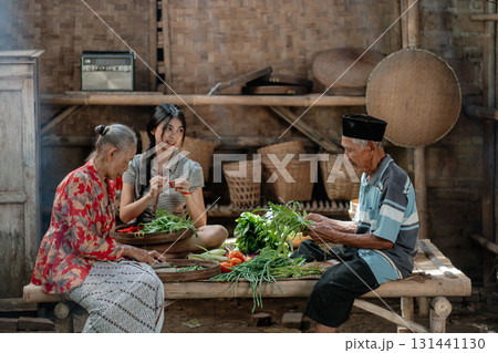 Traditional Gathering in a Rustic Kitchen Preparing Delicious Fresh Vegetables Traditional Gathering in a Rustic Kitchen Preparing Delicious Fresh Vegetables 131441130