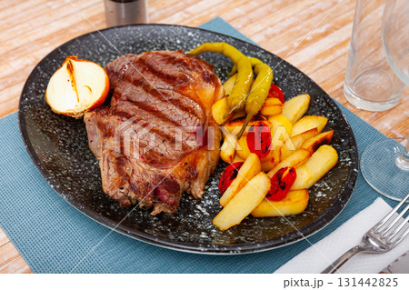 Tasty grilled beef with potato served Tasty grilled beef with potato served 131442825