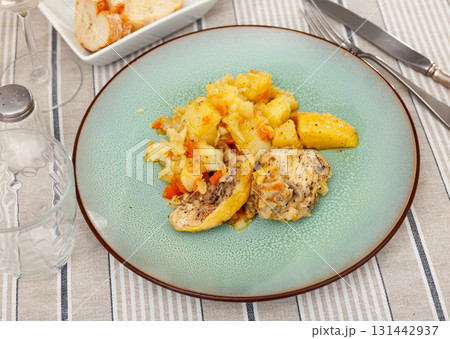 Baked chicken pieces with home-style stew potatoes for dinner Baked chicken pieces with home-style stew potatoes for dinner 131442937