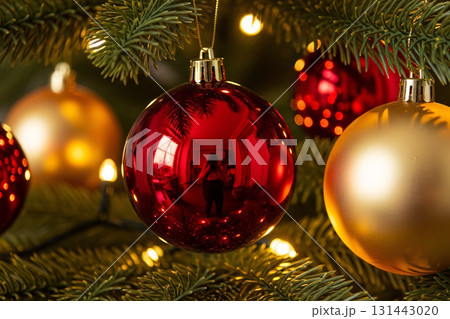 Red And Gold Christmas Ornaments On Tree 131443020