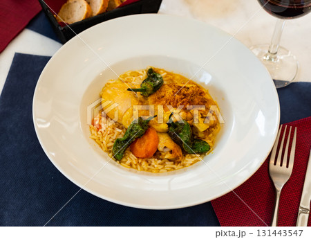 Traditional french cuisine, chicken thigh curry with rice 131443547
