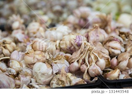 Garlic in basket on counter in market close up Garlic in basket on counter in market close up 131443548