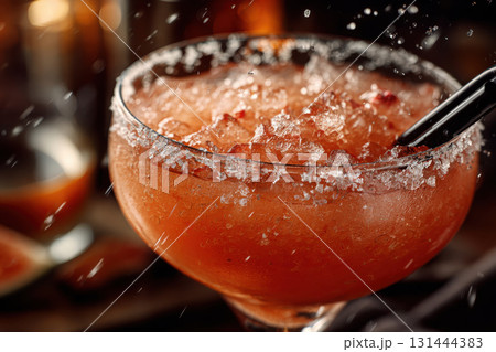 Refreshing frozen cocktail served with a salted rim and straw Refreshing frozen cocktail served with a salted rim and straw 131444383