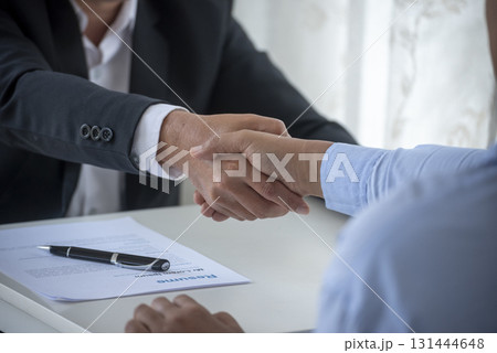 Close up hands Team Business Partners shaking hands together to Greeting Start up new project. Shakehand Teamwork Partnership office desk. Businessman partners handshake together. Business concept Close up hands Team Business Partners shaking hands together to Greeting Start up new project. Shakehand Teamwork Partnership office desk. Businessman partners handshake together. Business concept 131444648