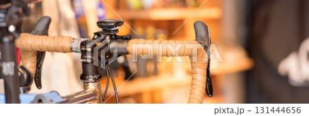 Vintage Bicycle on the wall decorate with bike cycle wheel in living room.Interior Design with people lifestyle hobby in a modern city. Bicycle with bulb lighting as background and loft decorate style Vintage Bicycle on the wall decorate with bike cycle wheel in living room.Interior Design with people lifestyle hobby in a modern city. Bicycle with bulb lighting as background and loft decorate style 131444656