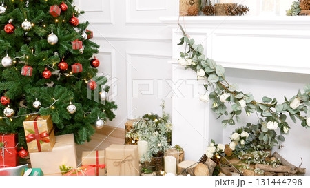 Christmas tree decorated holiday winter xmas celebration present gift to family decor bauble ornament golden ball in cozy living room. Merry Christmas and happy new year festival traditional concept Christmas tree decorated holiday winter xmas celebration present gift to family decor bauble ornament golden ball in cozy living room. Merry Christmas and happy new year festival traditional concept 131444798