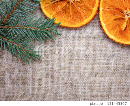 Christmas photo of a fir branch and dried oranges 131445567