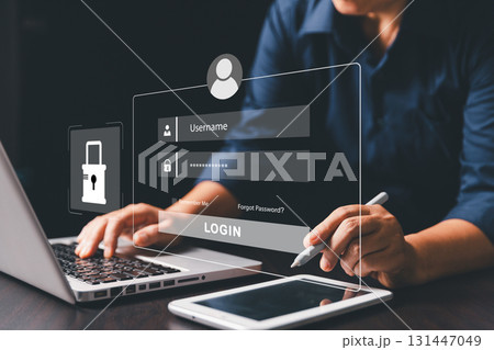 Businesswoman is securing laptops and protecting personal data through virtual interfaces, preventing online theft by applying key cybersecurity. UX design, mobile apps, User login interface concept. 131447049