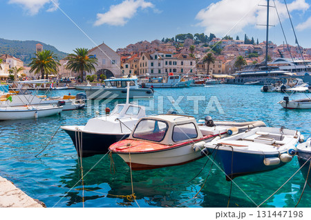 Hvar town harbor with boats and historic buildings 131447198