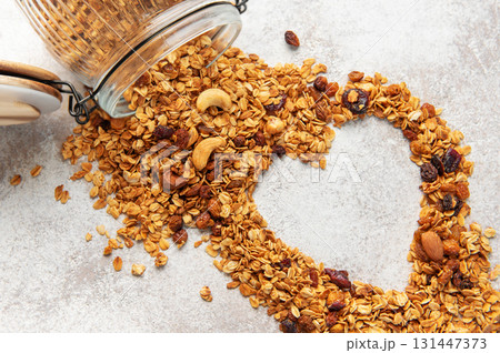 Granola making heart shape for healthy breakfast 131447373