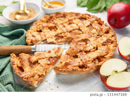 Homemade apple pie with ingredients on concrete background Homemade apple pie with ingredients on concrete background 131447389
