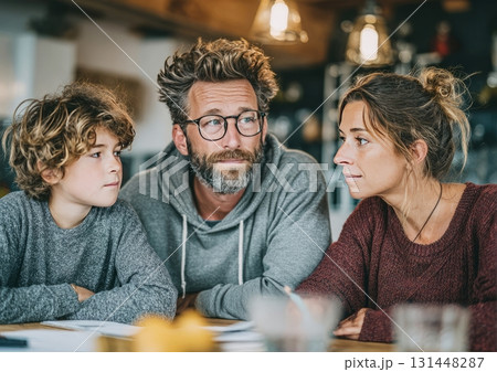 Family discussing serious topic at home table Family discussing serious topic at home table 131448287