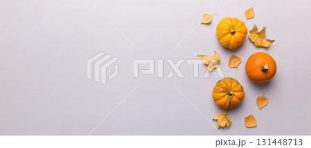 Autumn composition. Pattern made of dried leaves and other design accessories on table. Flat lay, top view Autumn composition. Pattern made of dried leaves and other design accessories on table. Flat lay, top view 131448713