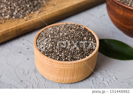 Chia seeds in bowl on colored background. Healthy Salvia hispanica in small bowl. Healthy superfood 131448982