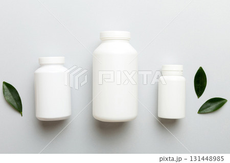 supplement pills with medicine bottle health care and medical top view. Vitamin tablets. Top view mockup bottle for pills and vitamins with green leaves, natural organic bio supplement, copy space supplement pills with medicine bottle health care and medical top view. Vitamin tablets. Top view mockup bottle for pills and vitamins with green leaves, natural organic bio supplement, copy space 131448985