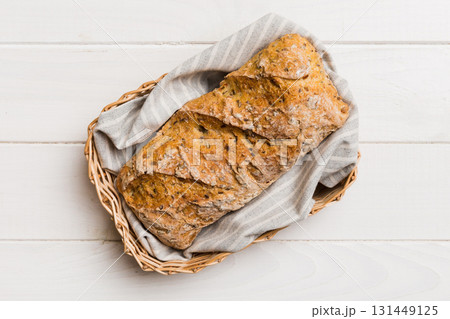 Freshly baked bread on basket against natural background. top view bread copy space 131449125