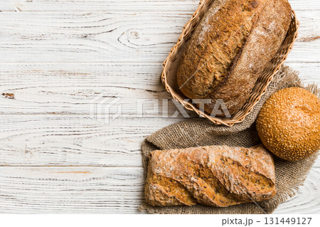 Freshly baked bread on basket against natural background. top view bread copy space 131449127