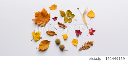 Autumn composition. Pattern made of dried leaves and other design accessories on table. Flat lay, top view 131449159