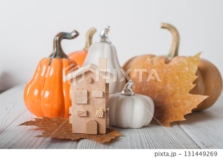 Minimal Wooden House with Heart and Pumpkins. Cozy Autumn Decor 131449269