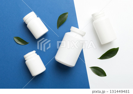 supplement pills with medicine bottle health care and medical top view. Vitamin tablets. Top view mockup bottle for pills and vitamins with green leaves, natural organic bio supplement, copy space supplement pills with medicine bottle health care and medical top view. Vitamin tablets. Top view mockup bottle for pills and vitamins with green leaves, natural organic bio supplement, copy space 131449481