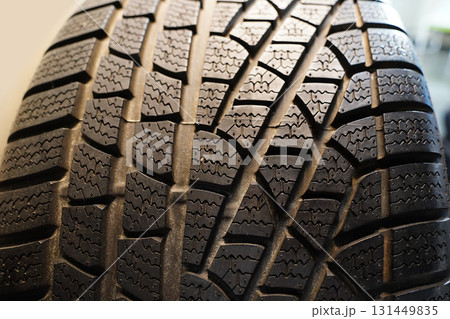 Close-up of a Car Tire Showing Detailed Tread Pattern 131449835