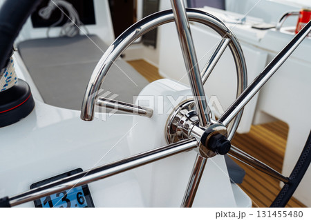 steering wheel on a yacht 131455480