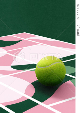 Colorful composition. Overscale tennis ball on pink and green patterned court 131456520