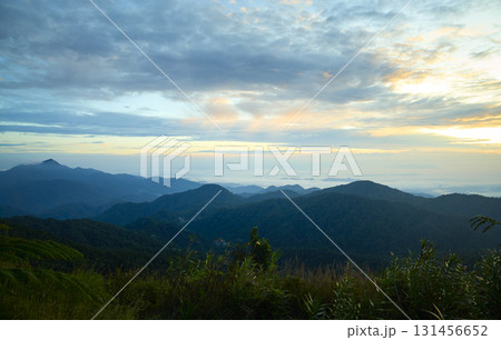 Sunrise illuminating lush mountain ranges in genting highlands, malaysia 131456652